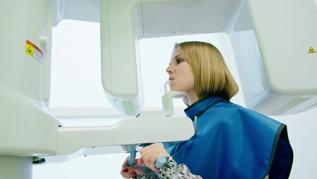 Scanning of the dental jaw The patient undergoes a procedure of panoramic radiography of the oral cavity in modern dentistry
