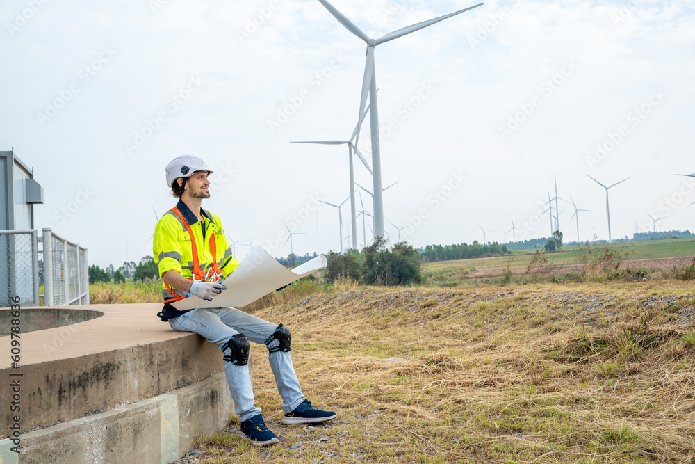 Poster Engineer inspecting a wind turbine,Wind turbines are an alternative electricity source to be sustainable resources in the future.