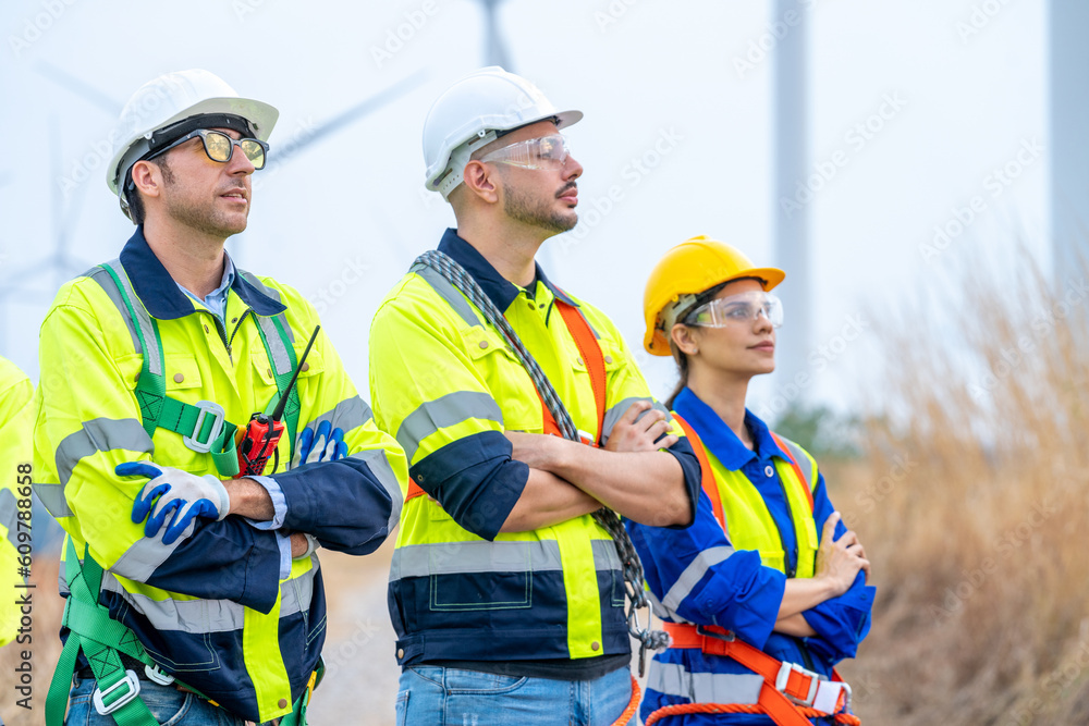 Poster technician engineer in uniform are checking wind turbine power farm, power generator station,clean e