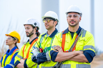 Engineer with technician are inspection work in wind turbine farms rotation to generate electricity energy.