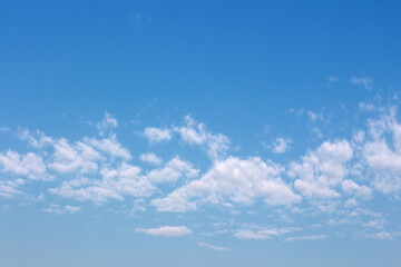 Blank sky surface with small clouds