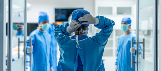 Professional doctors performing surgical operation in operating room. 