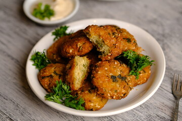 Falafel is a deep-fried ball or patty made from ground chickpeas, fava beans, or both. Falafel is a traditional Middle Eastern food, commonly served in a pita, which acts as a pocket, or wrapped. 