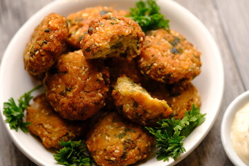 Falafel is a deep-fried ball or patty made from ground chickpeas, fava beans, or both. Falafel is a traditional Middle Eastern food, commonly served in a pita, which acts as a pocket, or wrapped. 