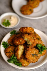Falafel is a deep-fried ball or patty-shaped fritter in Middle Eastern cuisine made from ground chickpeas, broad beans, or both. 