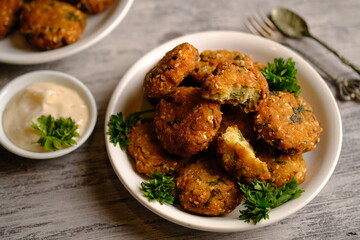 Falafel is a deep-fried ball or patty made from ground chickpeas, fava beans, or both. Falafel is a traditional Middle Eastern food, commonly served in a pita, which acts as a pocket, or wrapped. 