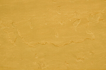 gold slate stone background or texture. gold stone