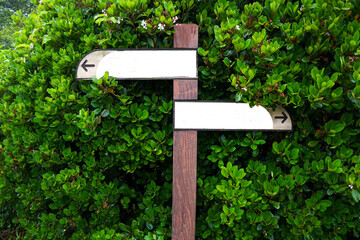 Blank direction sign made of brown wood
