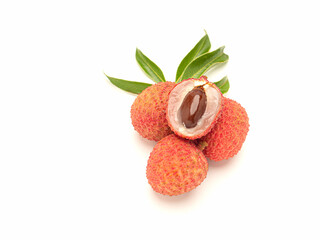 Fresh ripe lychees and peeled lychee fruit with green leaves on a white background.