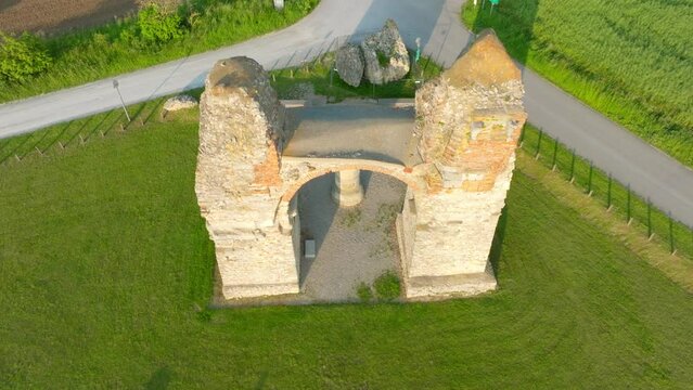 Roman City Gate Heidentor In Petronell-Carnuntum, Austria - aerial drone shot