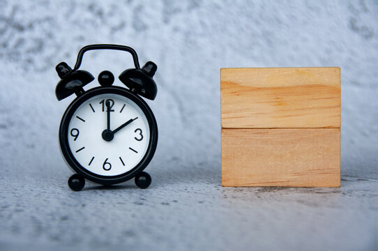 Alarm clock with wooden blocks with customizable space for text. Copy space
