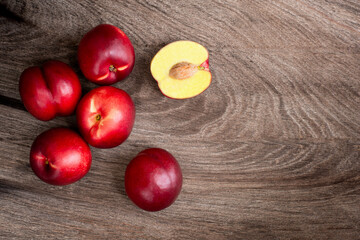 Peach fruit on wooden background