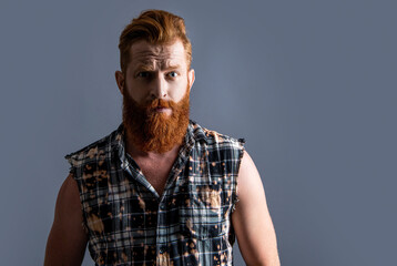 bearded brutal masculine man on background. photo of brutal masculine man with beard.