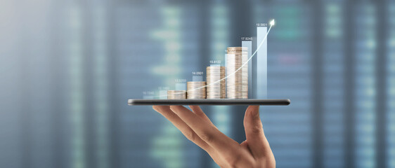 Hand holding smartphone device and touching screen. Stock exchange market concept. looking