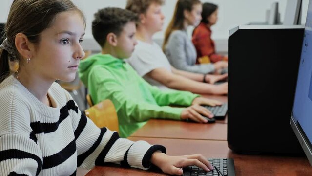 ids using personal computers during lesson in computer class.