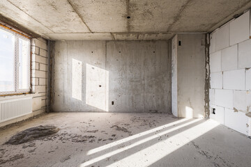 Empty concrete commercial space without finishing with partitions
