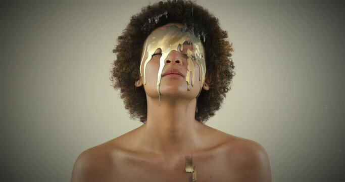 Face, beauty and black woman with gold, paint and makeup in studio with nature overlay, art and gradient background. Golden, splash and African female model with creative, double exposure cosmetics