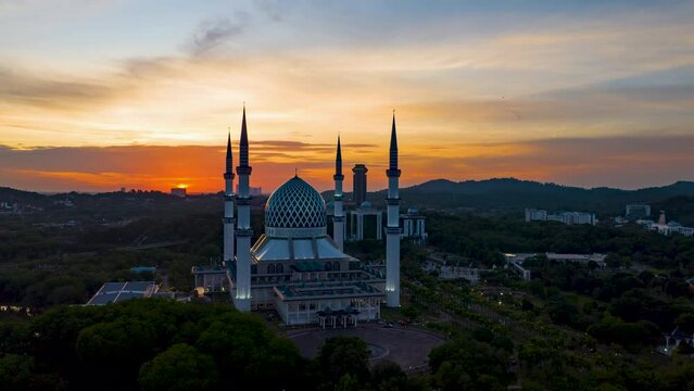 4K hyperlapse of Masjid Sultan Salahuddin Abdul Aziz Shah - The Blue Mosque during sunset. Biggest Mosque in Southeast Asia, Shah Alam, Malaysia. 