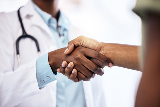 Handshake, welcome and a doctor meeting a patient in the hospital for healthcare, insurance or medical treatment. Medicine, trust or thank you with a health professional shaking hands in a clinic