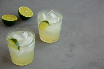 Homemade Cold Refreshing Iced Limeade in a Glass, side view. Copy space.