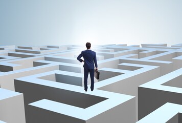 Businessman trying to escape from maze