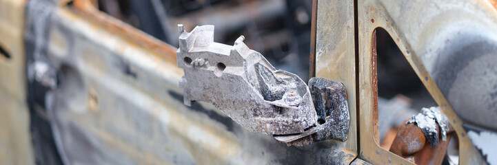 Burnt-out rusty cars on city street, vandalism. Setting fire to cars by vandals and damage to...