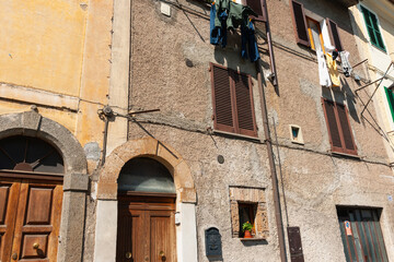 Quaint exterior wall of residential three level building