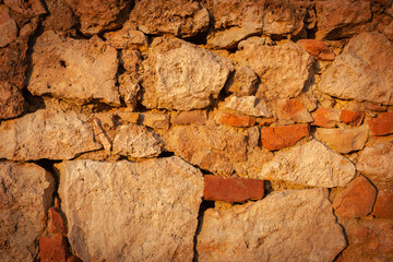 Stone wall detail closeup of random size rocks