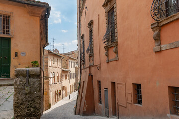 Fototapeta na wymiar Street and lane-way scene in walled Italian city of Volterra
