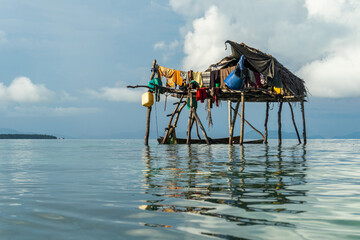 Fototapeta na wymiar The Bajau Laut stilt houses are built meters above sea level in the waters of Semporna, Malaysia. The architecture is constructed using logs or hard wood, such as mangrove wood
