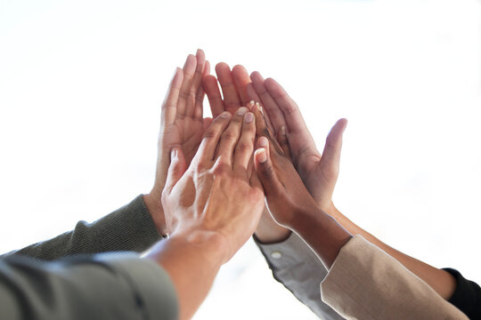 Success, white background or business people high five for winning a deal or group partnership achievement. Teamwork, winners or employees in celebration together with support, victory or solidarity