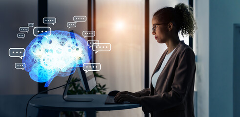 Black woman working in office and conversation AI concept. Deep learning. IoT (Internet of Things). ICT (Information Communication Technology).