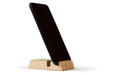 Smartphone stand. A modern phone on a wooden stand. Smartphone on a white background.