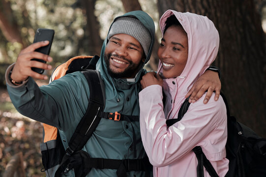 Black couple, hiking and hug for selfie, profile picture or vlog in travel adventure together in nature. African man and woman hiker hugging for photo, memory or social media and trekking in forest