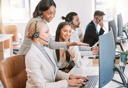 Call center, training and group of women at computer in discussion at help desk with advice from team leader. Learning, planning and help, black woman mentor coaching staff in customer service agency