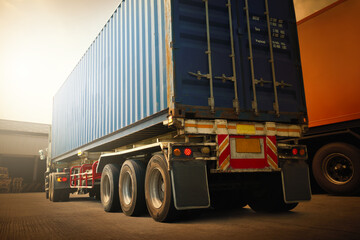 Semi Trailer Trucks on The Parking Lot at Warehouse. Shipping Cargo Container Delivery Trucks. Distribution Warehouse. Freight Trucks Logistic, Cargo Transport. 