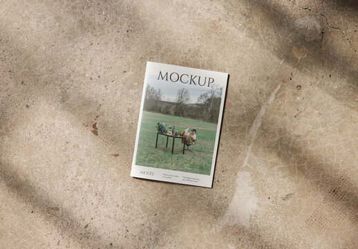Mockup of closed vertical A4 saddle stich magazine with customizable front cover