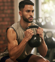 Weightlifting, fitness and man squat with dumbbell in gym for exercise, bodybuilder training and workout. Sports, muscles and serious male person with weight for wellness, healthy body and strength