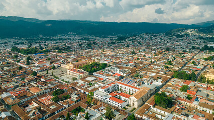 Beautiful aerial view of the rooftops of the old colonial buildings in the city of san cristobal de las Casas on the sunset