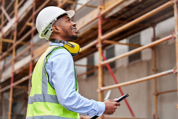 Architecture, inspection and checklist with black man on construction site for engineering,...