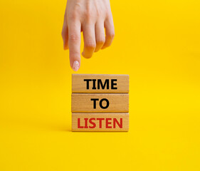 Time to listen symbol. Wooden blocks with words Time to listen. Beautiful yellow background. Businessman hand. Business and Active listening concept. Copy space.