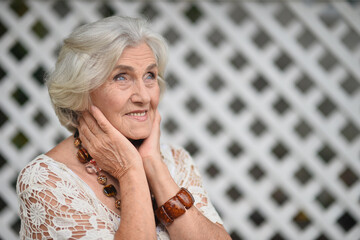 beautiful woman against the background of the trellis