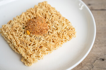 Instant noodles with condiments on the plate