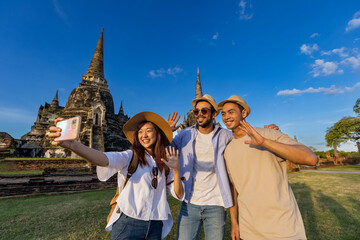 Tourists take selfie photo at Wat Phra Si Sanphet temple, Ayutthaya Thailand, for travel, vacation, holiday, honeymoon and tourism concept