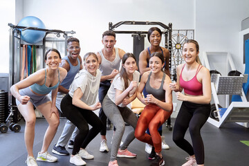 Fototapeta premium Diverse Group of Friends in Gym, Looking at Camera, Enjoying Themselves