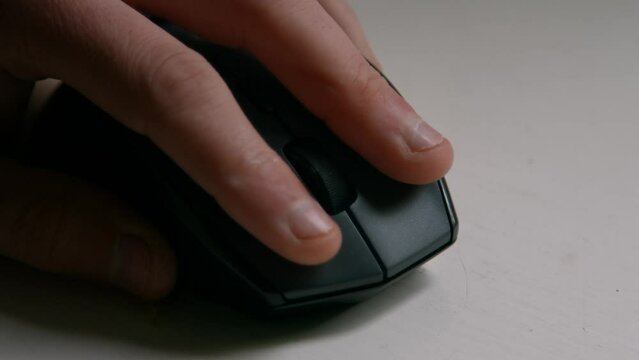 Close Up of Hand Using Computer PC Mouse Clicking and Scrolling