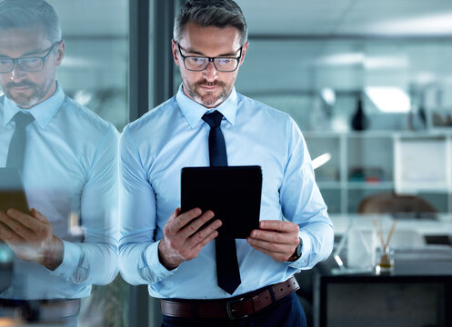 Reading email, corporate and a businessman with a tablet for communication, app or legal research. Digital, internet and a mature lawyer with technology for connection, online work or report - Powered by Adobe