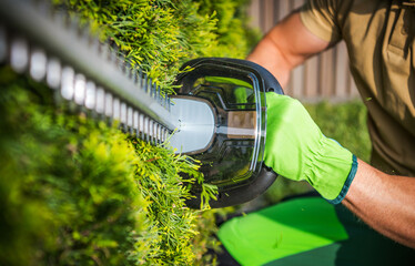 Powerful Cordless Electric Hedge Trimmer Close Up.