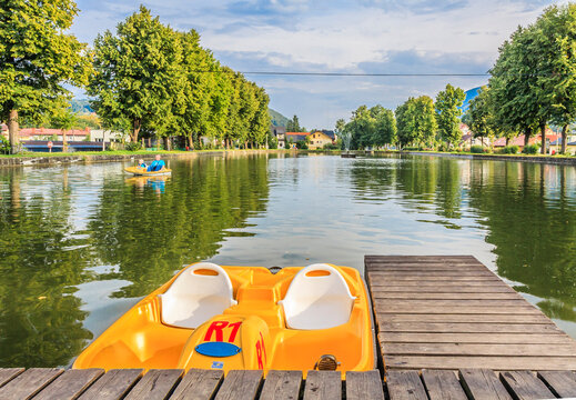 The pond in Ustroń in the Silesian Beskids (Poland) on a sunny summer day - a place of relaxation for residents and tourists with the possibility of kayaking, boating or paddle boating.
