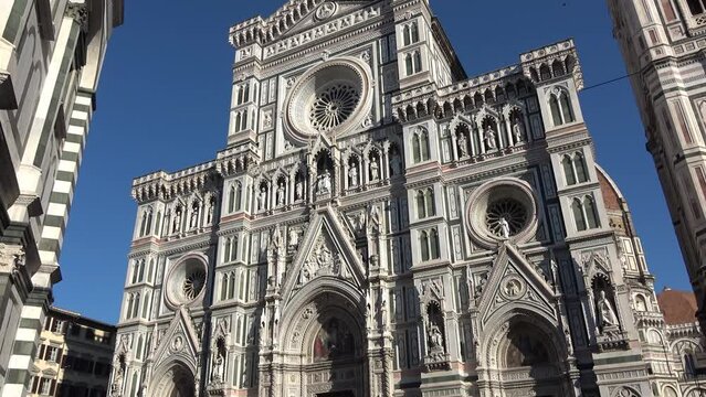 Florence, Italy, seen from below. Details of the cathedral and Giotto's bell tower. View of the Basilica of Santa Maria del Fiore.